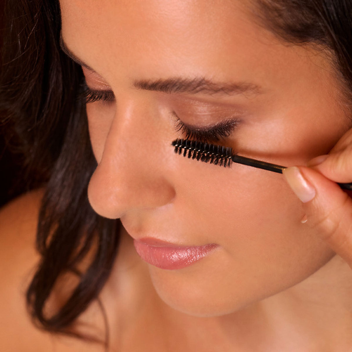 Applying mascara to tinted lashes