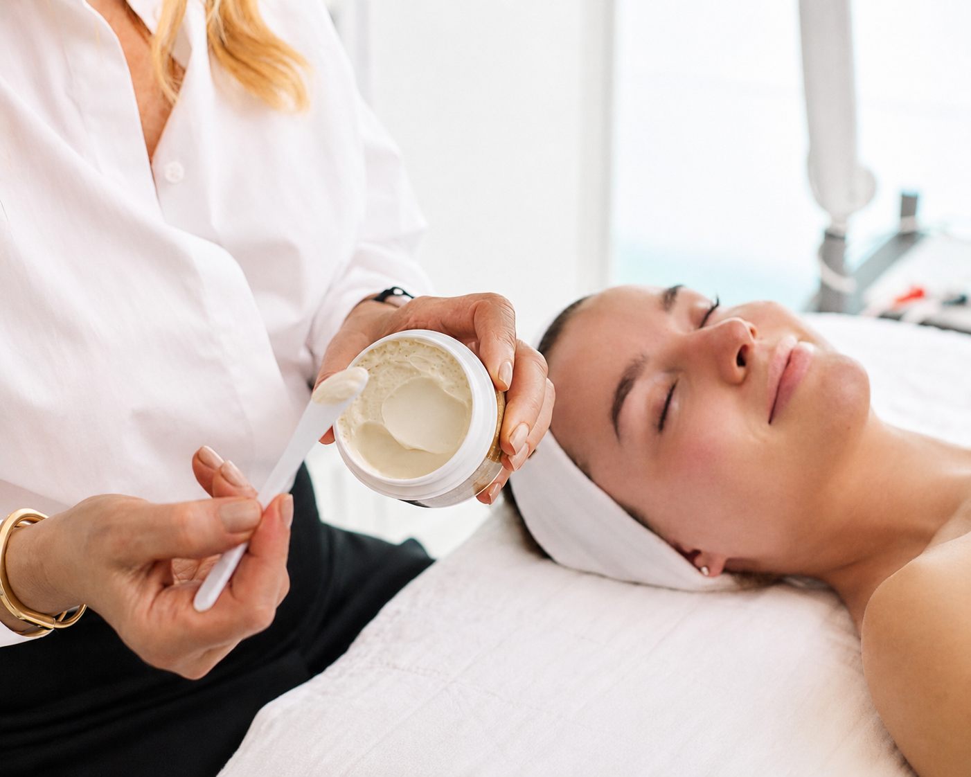 Esthetician preparing a cream during the Sculpt and Lift Facial